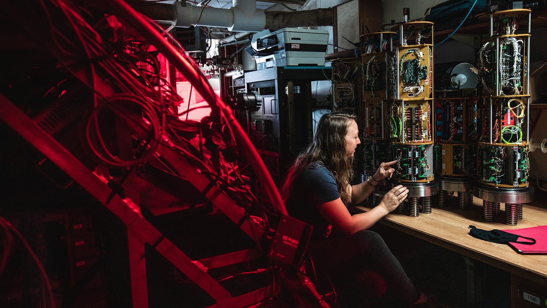 Alvin Group Electrical Engineer Rose Wall working on the power data and imaging chassis that powers and controls the sub's external equipment. (Image Credit: Daniel Hentz © WHOI)