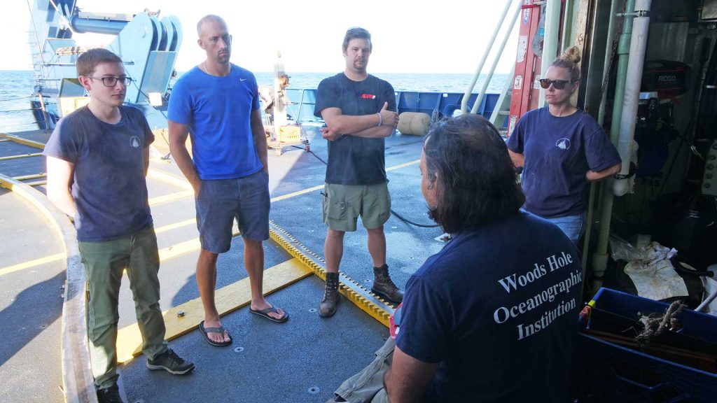 New Alvin divers get an introduction to the sub before the final series of dives on sea trials. (Photo by Ken Kostel, ©Woods Hole Oceanographic Institution))
