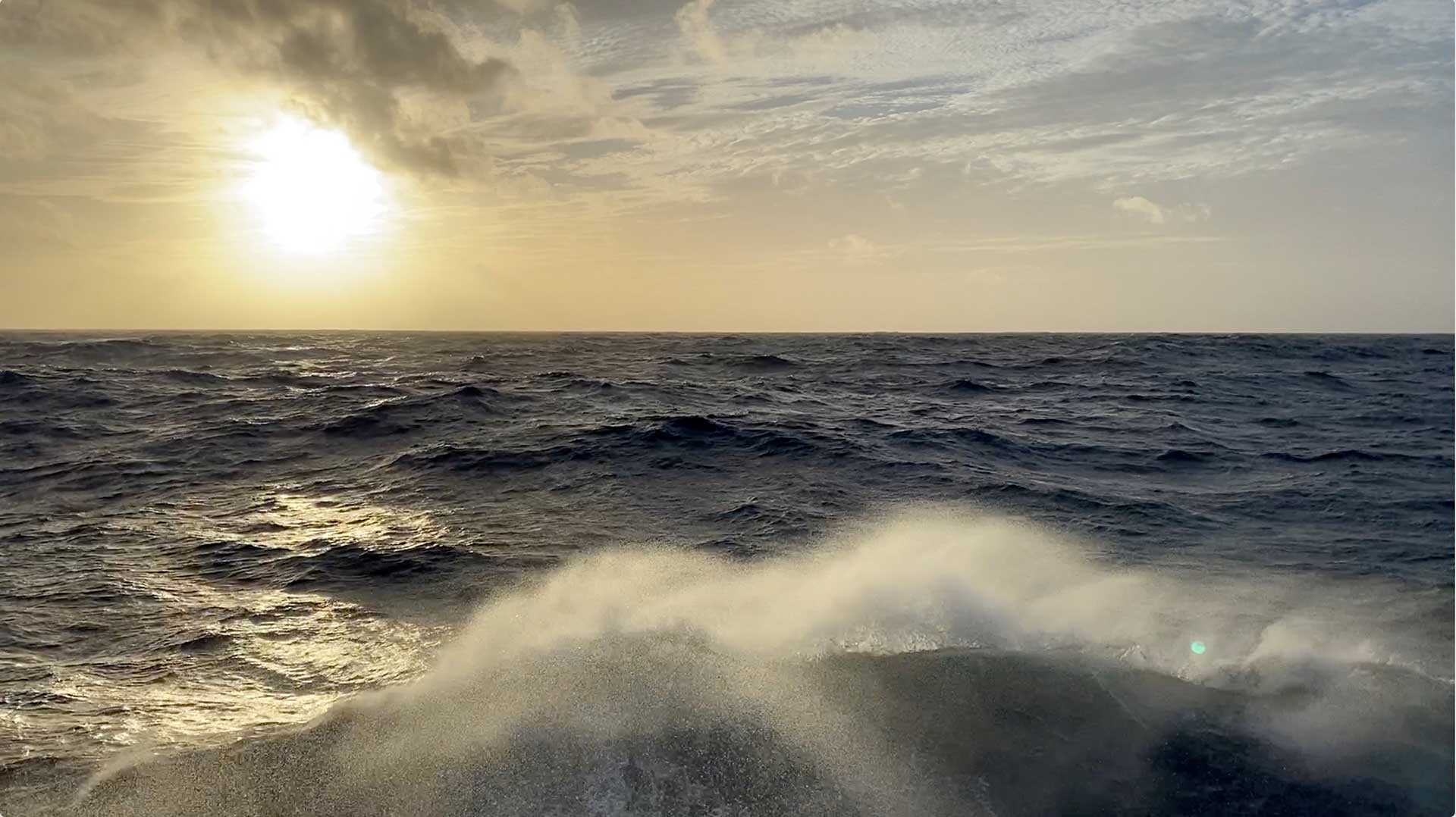 Rough weather at the start of our transit to Mona Canyon made for a bumpy ride, but beautiful sunsets. (Photo by Ken Kostel, ©Woods Hole Oceanographic Institution))
