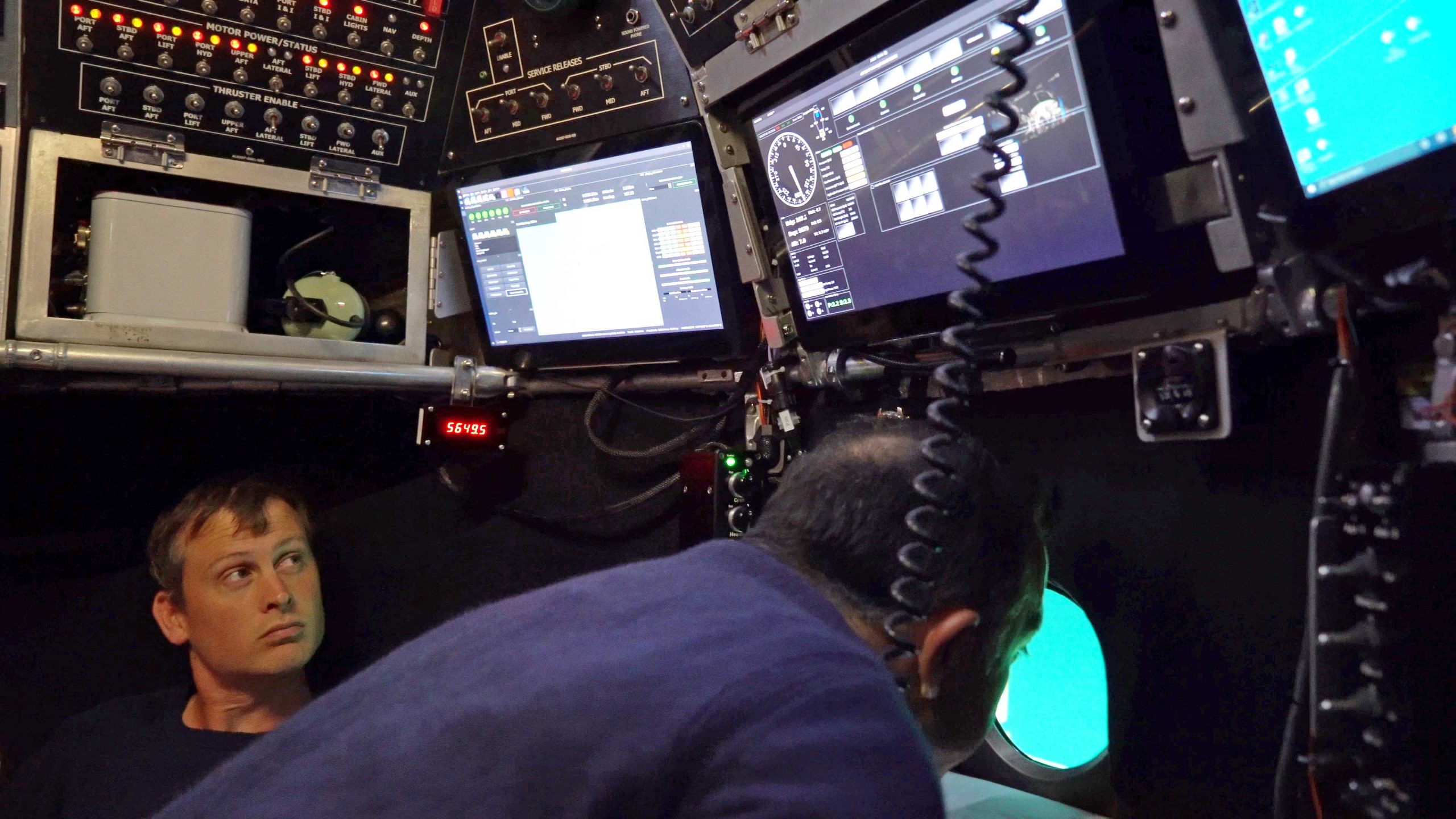 Pilot Anthony Tarantino maneuvers Alvin over the seafloor near its 6453 meters depth while Fran Elder monitors systems inside. (Photo by Mike Yankaskas, NAVSEA, ©Woods Hole Oceanographic Institution)