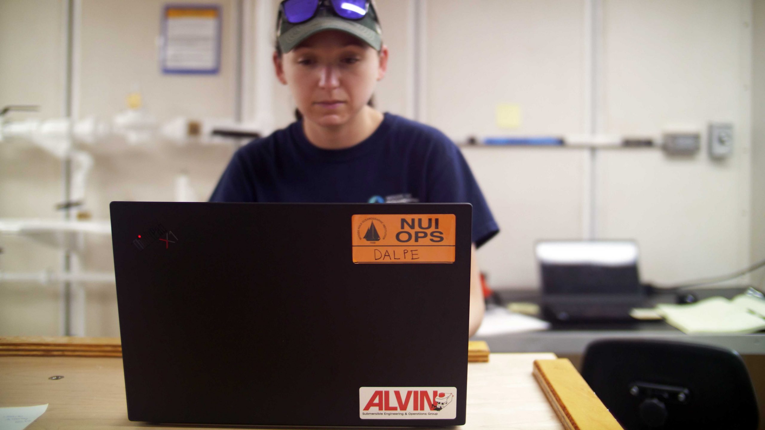 Allisa Dalpe's work at sea with NUI and Alvin often consists of interacting with her vehicle via her laptop. (Photo by Ken Kostel, ©Woods Hole Oceanographic Institution)