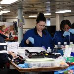 Emilie Skoog, Alexis Adams, and Kayla Nedd process deep sea water samples. (Photo by Hannah Piecuch, © Woods Hole Oceanographic Institution)